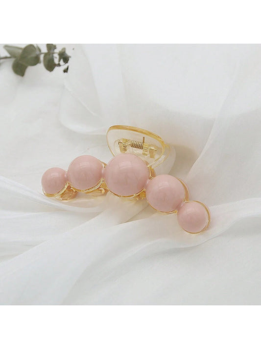 Lys HÄrklemme med LyserÞde Runde Perler